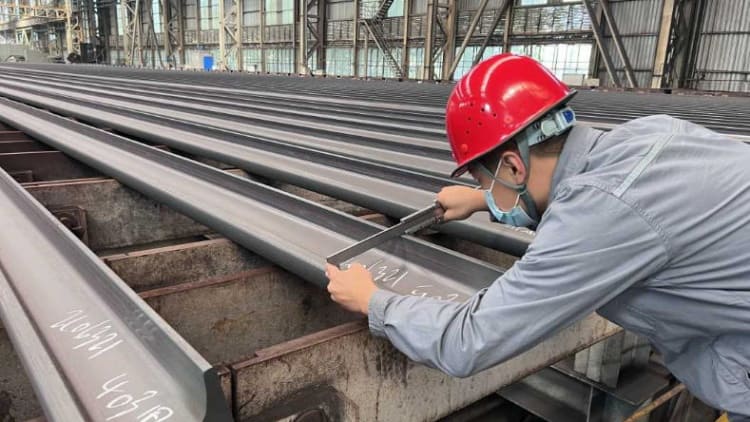 Quality inspector checking special steel and MTC certificate